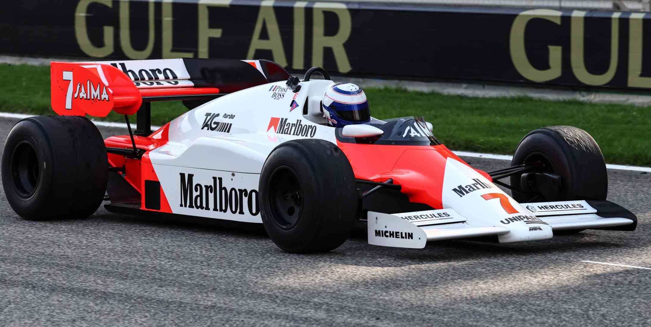 Four time Formula 1 world champion Alain Prost crossing the line in a McLaren Formula 1 car