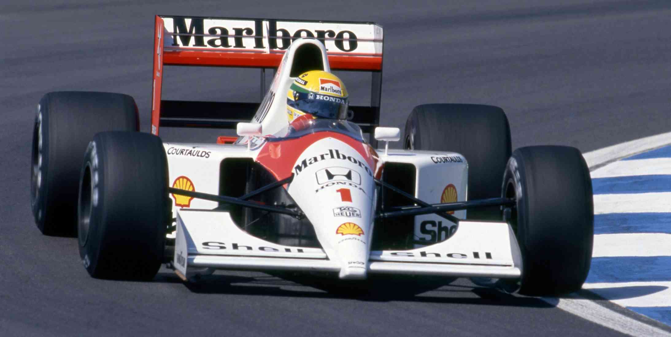 Three times Formula 1 World Champion Ayrton Senna from Brazil drivers his McLaren F1 car around a race track